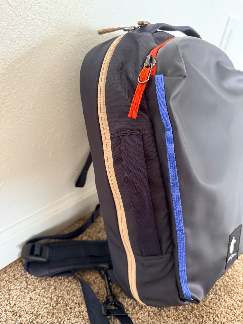 cotopaxi Black Sling Backpack with Blue Piping and Red Zip Pull - Picture 5 of 10
